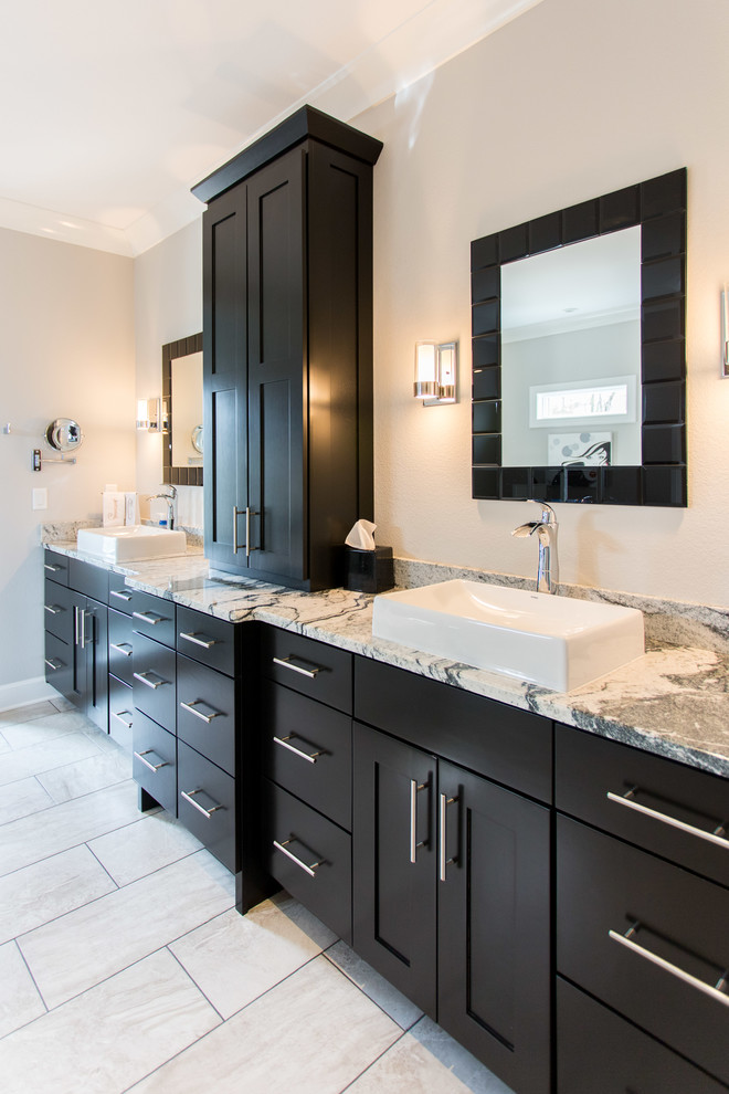 Photo of a large contemporary ensuite bathroom in Other with shaker cabinets, black cabinets, beige walls, porcelain flooring, a vessel sink and granite worktops.