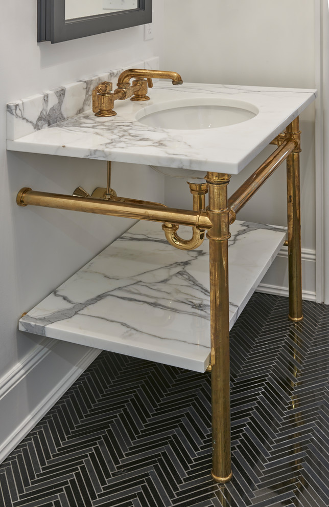 Inspiration for a transitional marble floor corner shower remodel in New York with an undermount sink, marble countertops and a hinged shower door
