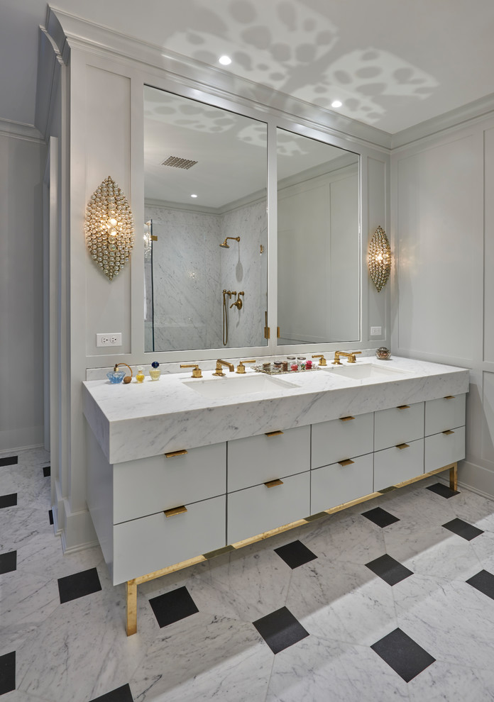 Ispirazione per una stanza da bagno tradizionale con doccia ad angolo, pavimento in marmo, lavabo sottopiano, top in marmo e porta doccia a battente