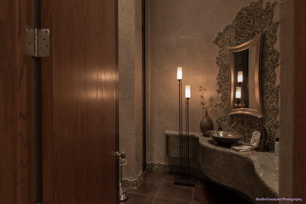 Cette image montre une grande salle d'eau design en bois foncé avec un placard à porte shaker, une douche d'angle, WC à poser, un carrelage beige, un carrelage noir et blanc, un carrelage marron, un carrelage gris, une plaque de galets, un mur beige, un sol en carrelage de céramique, un lavabo posé et un plan de toilette en granite.