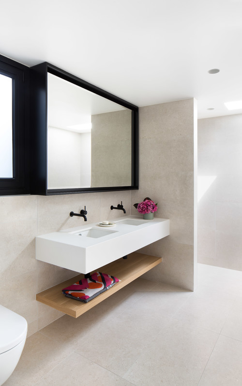 Floating in Style: Enhance Your Bathroom with White Vanity and Wood Shelf Innovations
