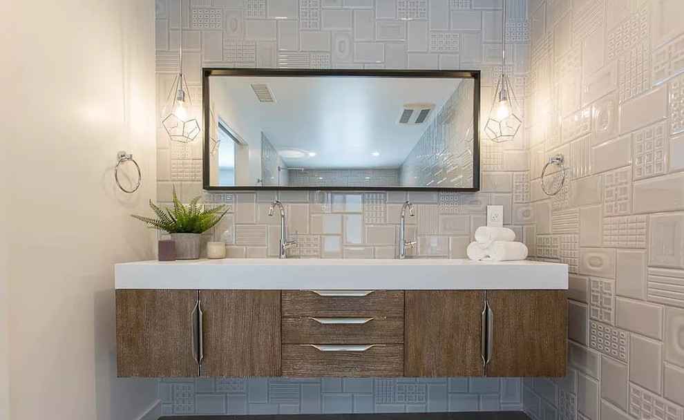 Bathroom - large modern master gray tile and porcelain tile concrete floor and gray floor bathroom idea in Los Angeles with flat-panel cabinets, dark wood cabinets, a wall-mount toilet, gray walls, an undermount sink, quartz countertops and white countertops