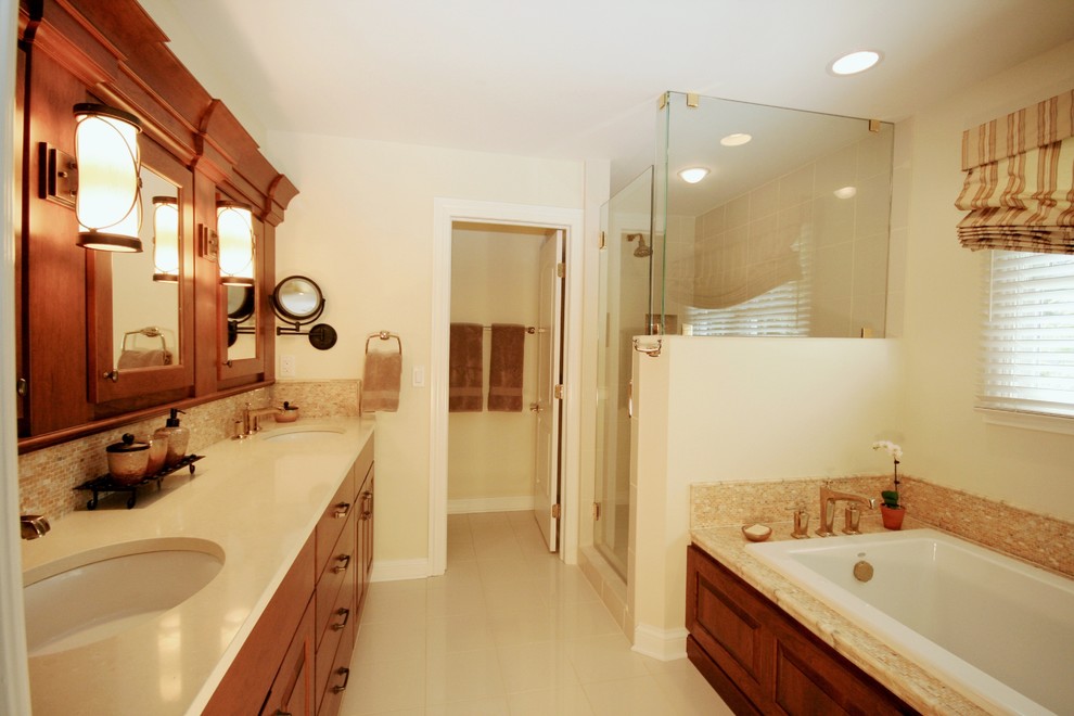 Design ideas for a medium sized traditional bathroom in San Francisco with a submerged sink, raised-panel cabinets, medium wood cabinets, engineered stone worktops, a built-in bath, beige tiles, porcelain tiles, beige walls and porcelain flooring.