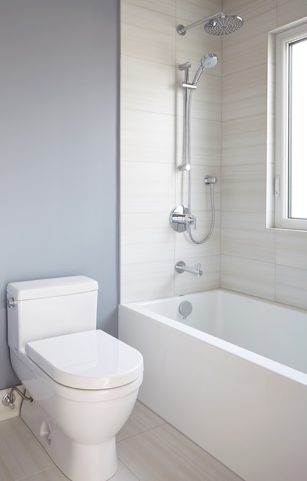Inspiration for a small traditional bathroom in Toronto with a submerged sink, shaker cabinets, medium wood cabinets, engineered stone worktops, an alcove bath, a shower/bath combination, a one-piece toilet, beige tiles, ceramic tiles, white walls and porcelain flooring.