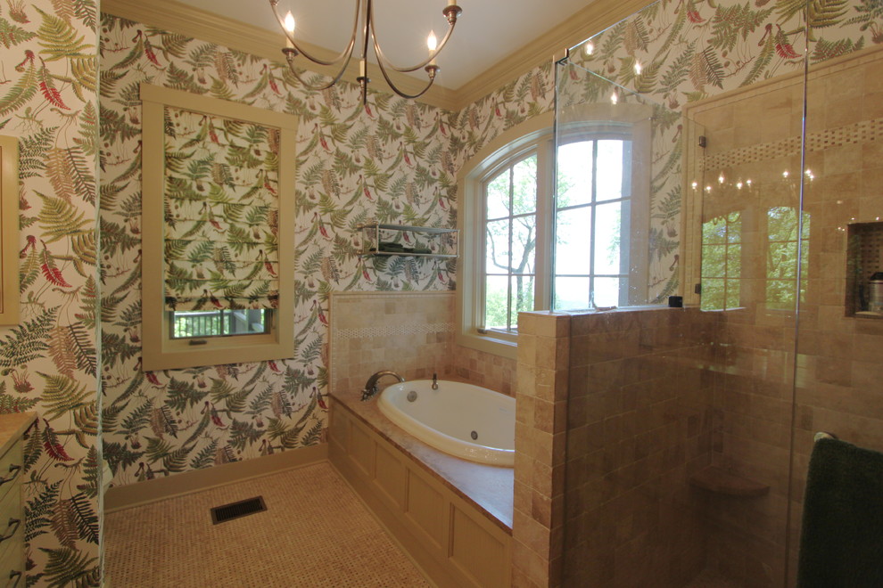 This is an example of a large world-inspired ensuite bathroom in Charlotte with a built-in bath, a corner shower, beige tiles, stone tiles, green walls and mosaic tile flooring.