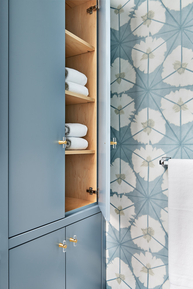 Alcove shower - mid-sized transitional kids' blue tile and porcelain tile marble floor and white floor alcove shower idea in Toronto with flat-panel cabinets, blue cabinets, a one-piece toilet, blue walls, an undermount sink, quartz countertops and a hinged shower door