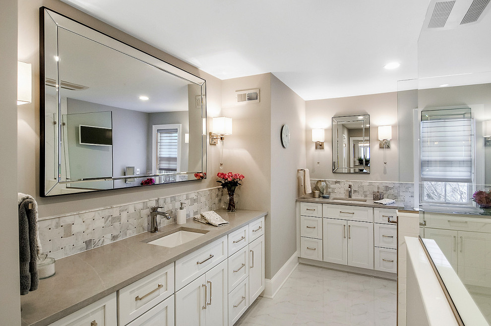 Inspiration for a mid-sized transitional master white tile and porcelain tile porcelain tile and white floor bathroom remodel in Philadelphia with shaker cabinets, white cabinets, a two-piece toilet, beige walls, an undermount sink, quartz countertops and gray countertops