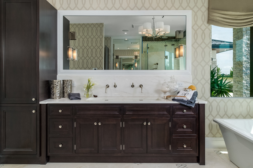 Bathroom - mid-sized transitional master gray tile, multicolored tile, white tile and marble tile travertine floor and beige floor bathroom idea in Miami with shaker cabinets, dark wood cabinets, beige walls, an undermount sink, marble countertops and a hinged shower door