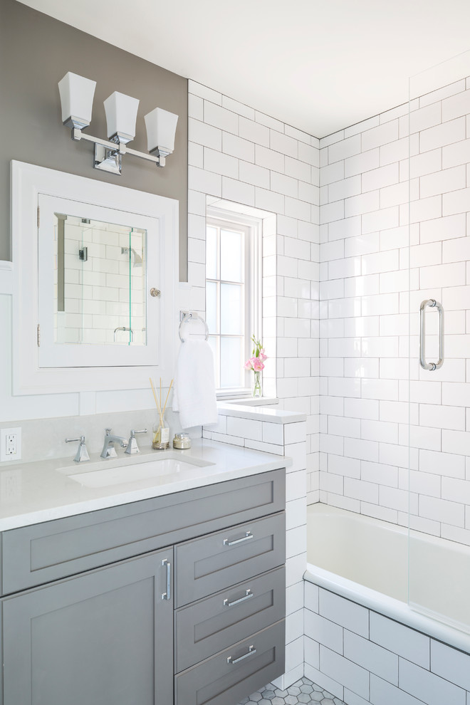 Classic bathroom in Seattle with recessed-panel cabinets, grey cabinets, a built-in bath, white tiles, metro tiles, grey walls, a submerged sink, engineered stone worktops and an open shower.