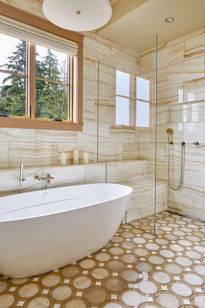 Photo of a classic ensuite bathroom in Seattle with flat-panel cabinets, light wood cabinets, a freestanding bath, a built-in shower, marble tiles, mosaic tile flooring, a submerged sink, a hinged door, white worktops, an enclosed toilet, a single sink and a built in vanity unit.