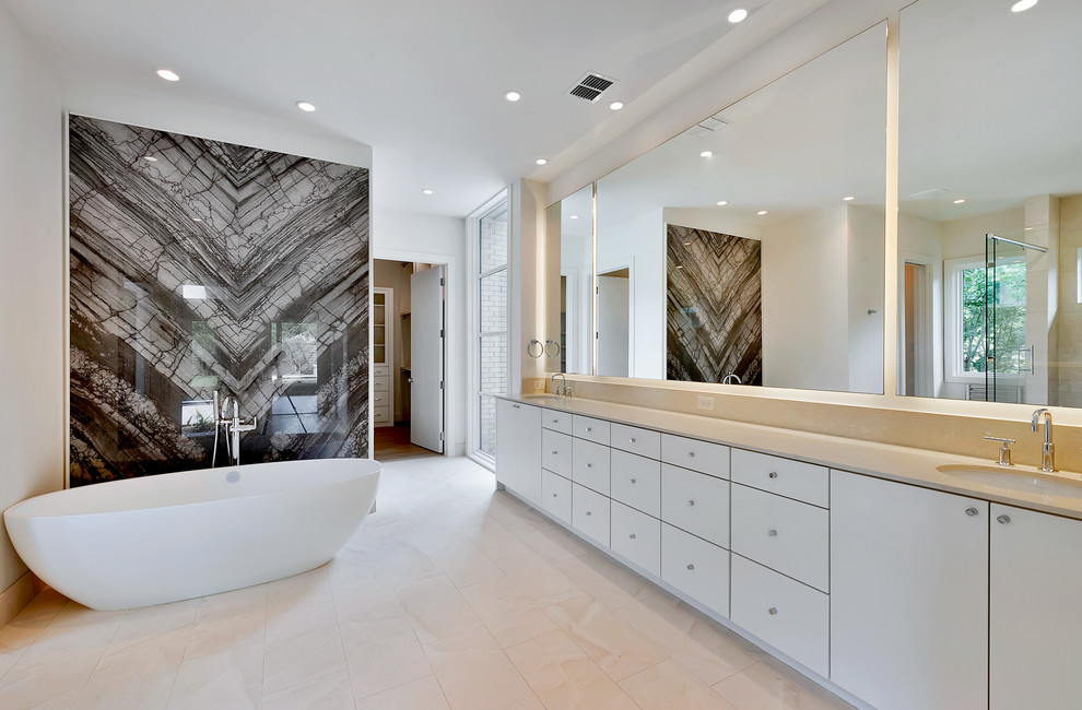 Example of a large trendy master ceramic tile freestanding bathtub design in Dallas with flat-panel cabinets, white cabinets, white walls and an undermount sink