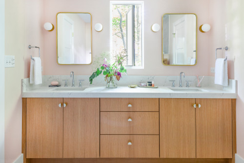 Tips to keep bathroom cabinets clean and stylish with wood vanity, quartz countertop, and double mirrors