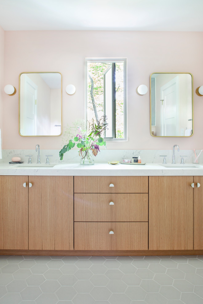 Medium sized classic family bathroom in Chicago with flat-panel cabinets, light wood cabinets, a corner shower, a two-piece toilet, white tiles, mosaic tiles, pink walls, a submerged sink, engineered stone worktops, grey floors, a hinged door and white worktops.