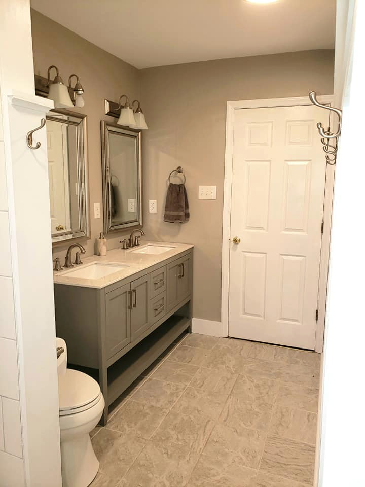 Inspiration for a medium sized modern family bathroom in Richmond with shaker cabinets, grey cabinets, an alcove bath, a shower/bath combination, a two-piece toilet, white tiles, porcelain tiles, grey walls, porcelain flooring, a submerged sink, engineered stone worktops, beige floors, a shower curtain and white worktops.