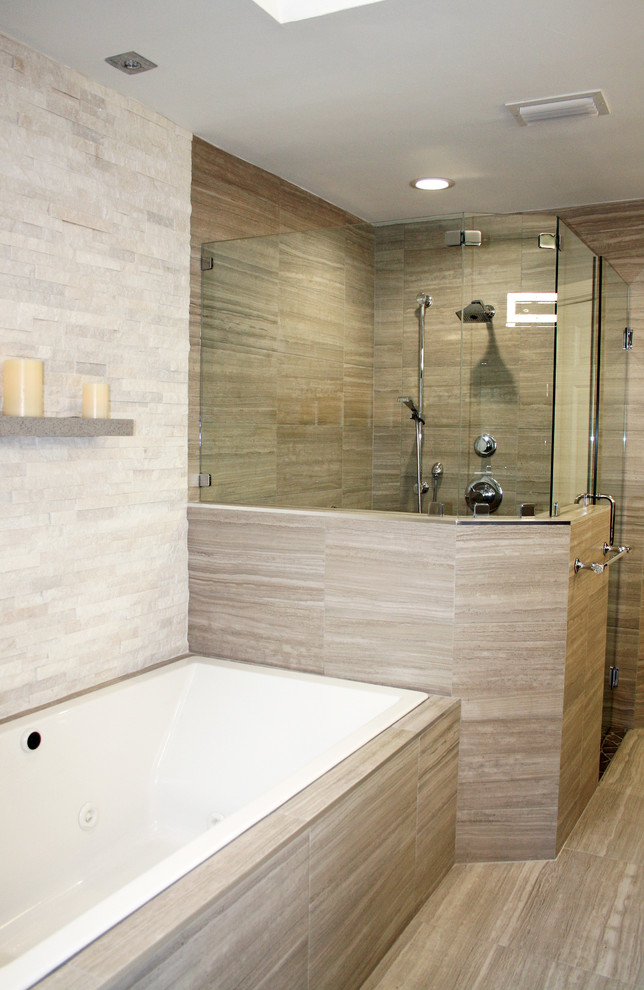 This is an example of a large modern ensuite bathroom in Miami with flat-panel cabinets, grey cabinets, a built-in bath, grey tiles, porcelain flooring, an alcove shower, a one-piece toilet, stone tiles, beige walls, a submerged sink, terrazzo worktops, grey floors and a hinged door.