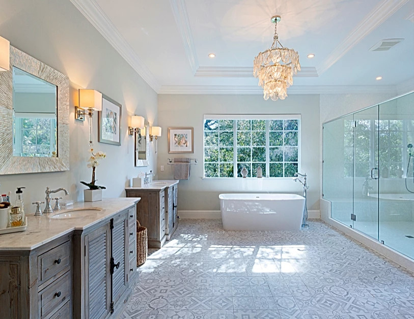 Photo of a large nautical bathroom in Miami with louvered cabinets, medium wood cabinets, a freestanding bath, an alcove shower, white tiles, grey walls, ceramic flooring, a built-in sink, multi-coloured floors, a hinged door, a shower bench, double sinks, a freestanding vanity unit and a drop ceiling.