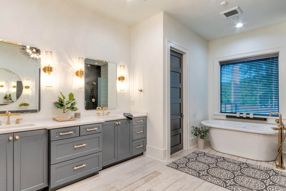 Example of a mid-sized country kids' white tile and ceramic tile ceramic tile, white floor and double-sink bathroom design in Atlanta with shaker cabinets, gray cabinets, a two-piece toilet, white walls, an undermount sink, quartz countertops, a hinged shower door, white countertops and a built-in vanity
