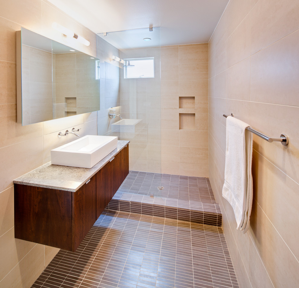 Photo of a modern half tiled bathroom in Dallas with a vessel sink.