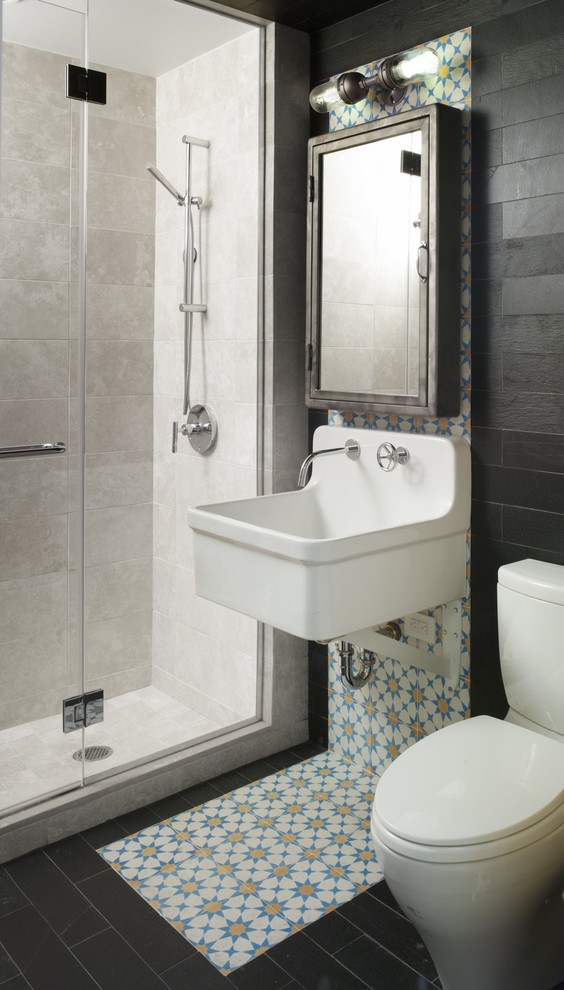 Example of an eclectic multicolored tile alcove shower design in New York with a wall-mount sink