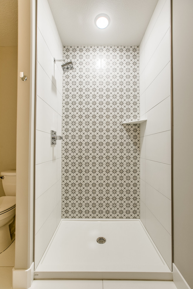 Design ideas for a scandi shower room bathroom in Omaha with shaker cabinets, grey cabinets, an alcove shower, a two-piece toilet, a submerged sink and engineered stone worktops.