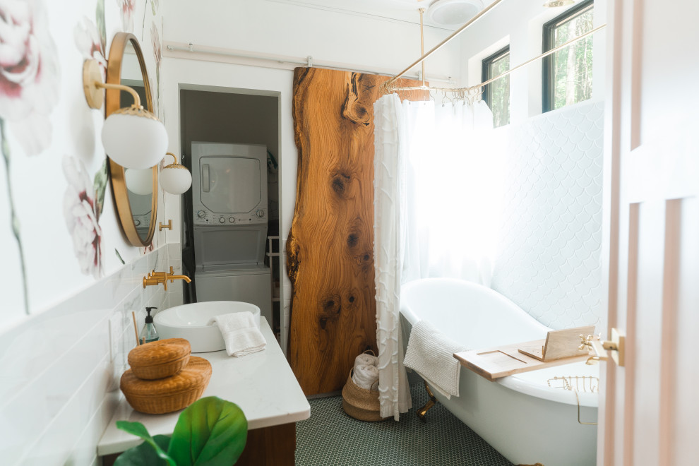Photo of a farmhouse bathroom in Columbus with a claw-foot bath, white tiles, multi-coloured walls, mosaic tile flooring, a vessel sink, green floors, white worktops, a single sink and a laundry area.