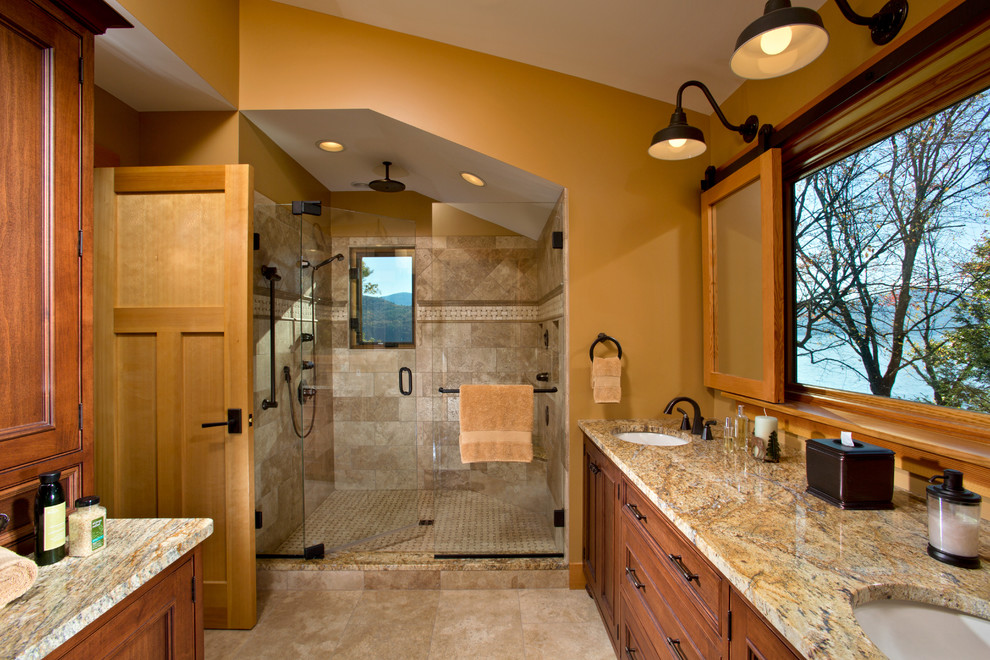 Inspiration for a master beige tile and stone tile alcove shower remodel in Boston with an undermount sink, beaded inset cabinets, dark wood cabinets, granite countertops and yellow walls