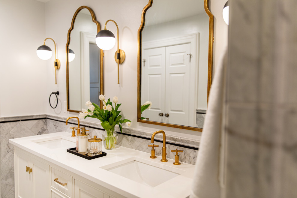Example of a classic master marble tile marble floor, double-sink and wainscoting bathroom design in Baltimore with beaded inset cabinets, white cabinets, a hinged shower door, white countertops and a freestanding vanity