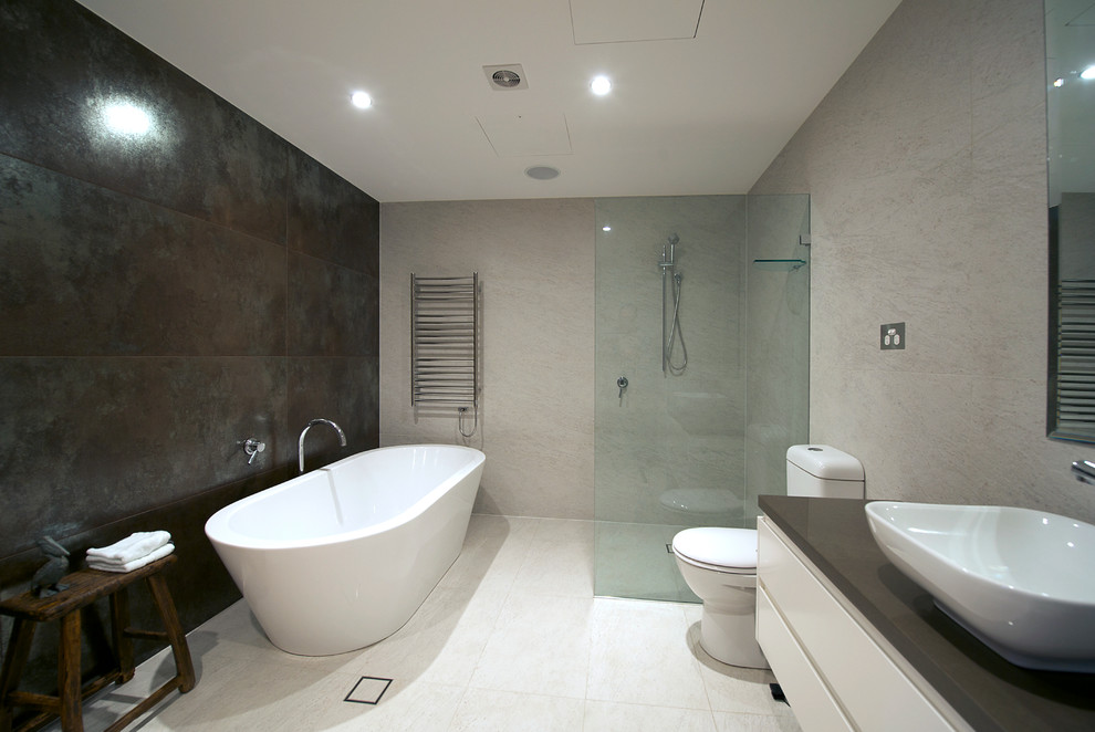 This is an example of an industrial bathroom in Sydney with porcelain tiles and porcelain flooring.