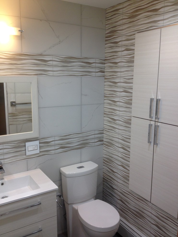 Example of a mid-sized eclectic master beige tile and porcelain tile porcelain tile tub/shower combo design in New York with flat-panel cabinets, white cabinets, a hot tub, a two-piece toilet, white walls, an integrated sink and quartz countertops