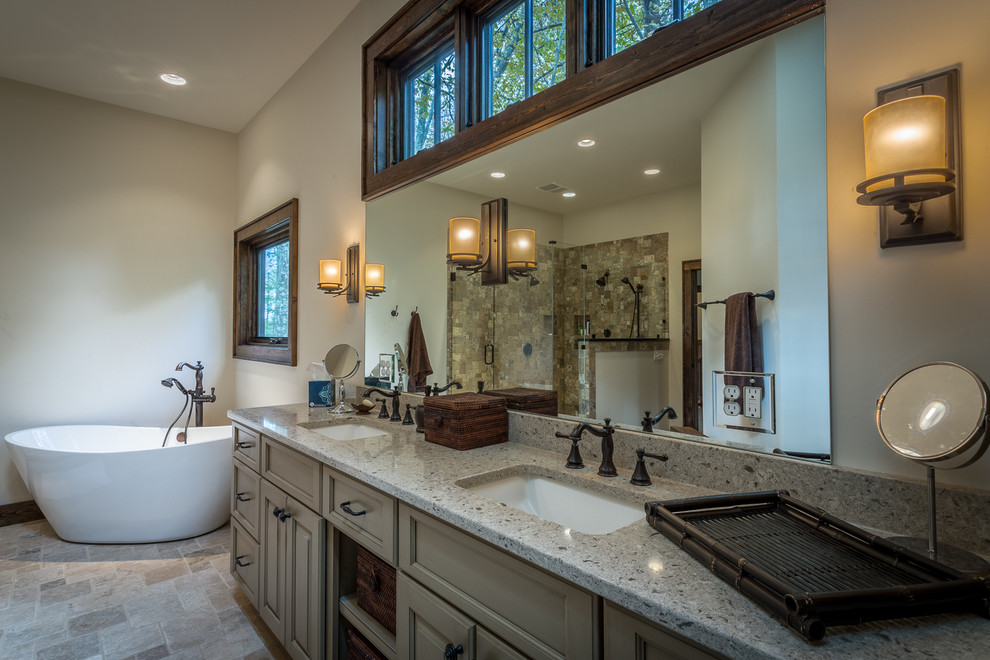 Example of a huge mountain style master beige tile and stone tile bathroom design in Charlotte with an undermount sink, recessed-panel cabinets, beige cabinets, granite countertops, a two-piece toilet and white walls