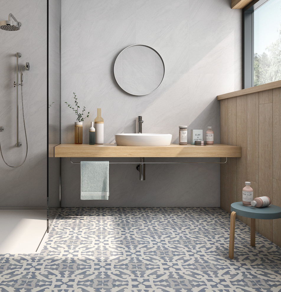 Bathroom - victorian porcelain tile and blue floor bathroom idea in Other