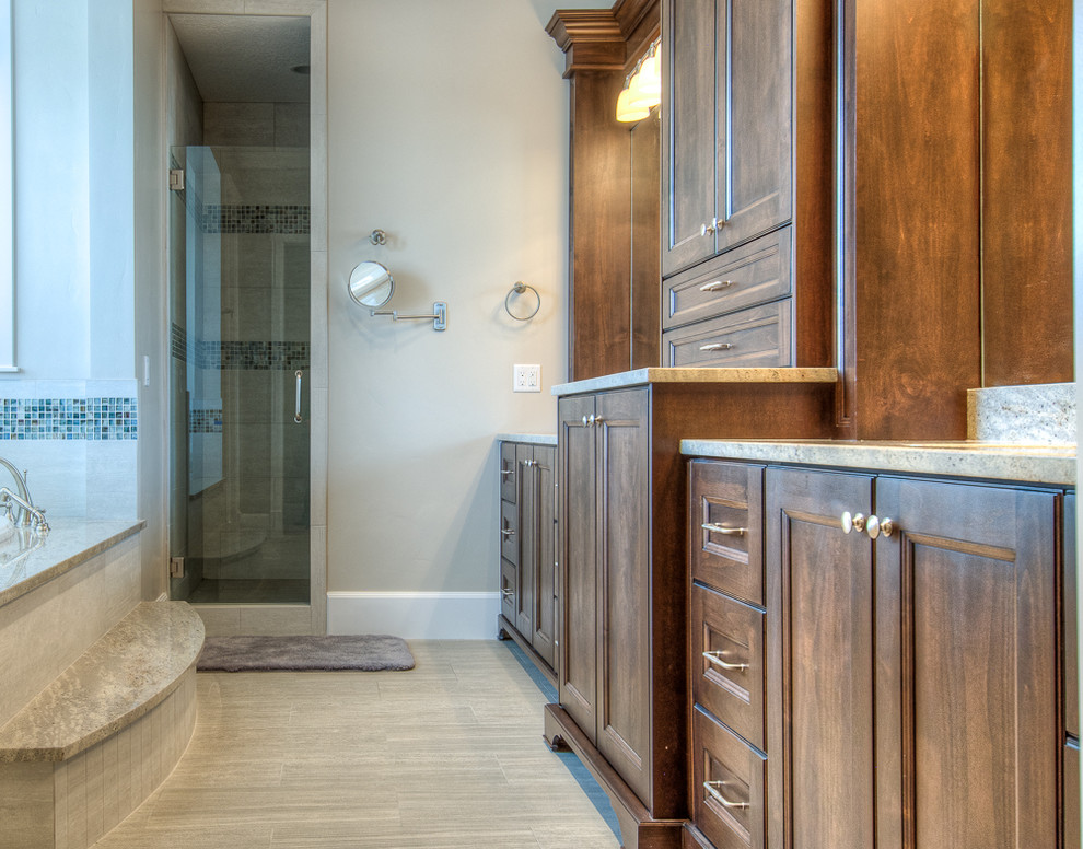 Medium sized classic ensuite bathroom in Salt Lake City with a submerged sink, recessed-panel cabinets, dark wood cabinets, granite worktops, an alcove bath, an alcove shower, a bidet, multi-coloured tiles, ceramic tiles, grey walls and ceramic flooring.