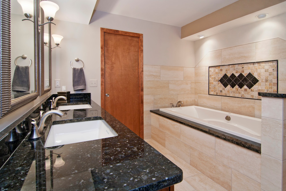 Inspiration for a contemporary bathroom remodel in Minneapolis with granite countertops