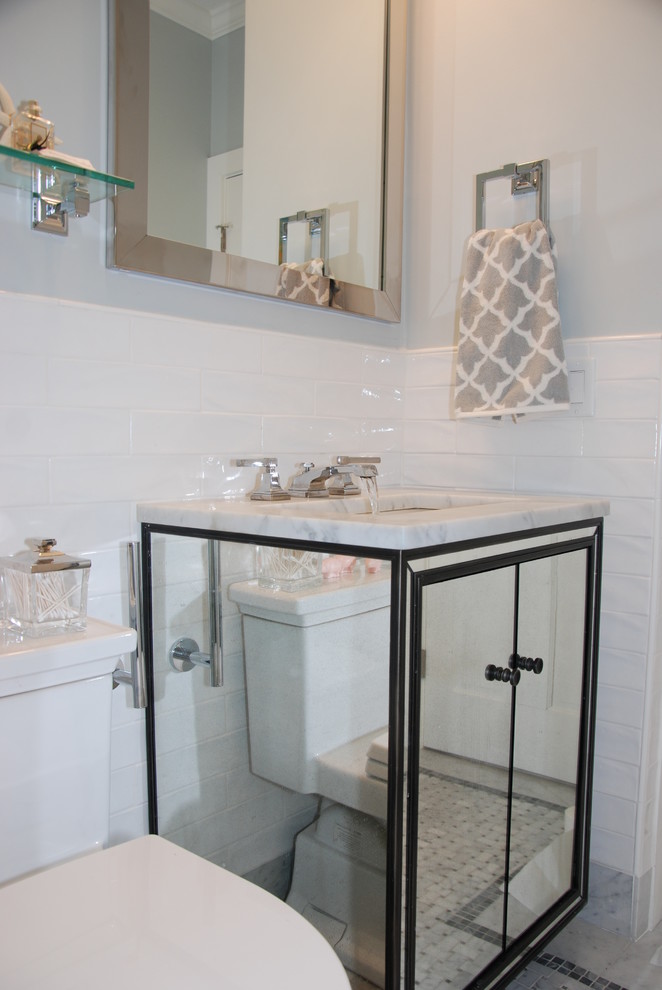 Medium sized modern family bathroom in Boston with a submerged sink, glass-front cabinets, marble worktops, a corner shower, a one-piece toilet, grey tiles, ceramic tiles, grey walls and ceramic flooring.