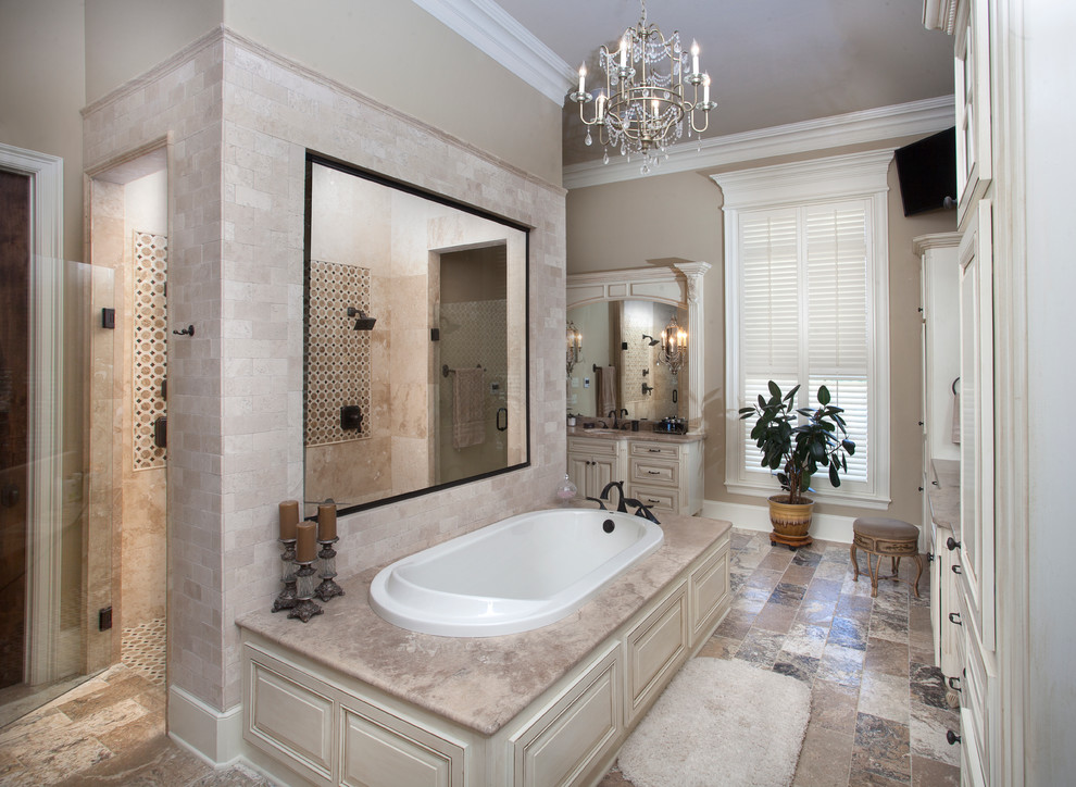 Bathroom - large traditional master multicolored tile and stone tile marble floor bathroom idea in New Orleans with an undermount sink, furniture-like cabinets, distressed cabinets, marble countertops and beige walls