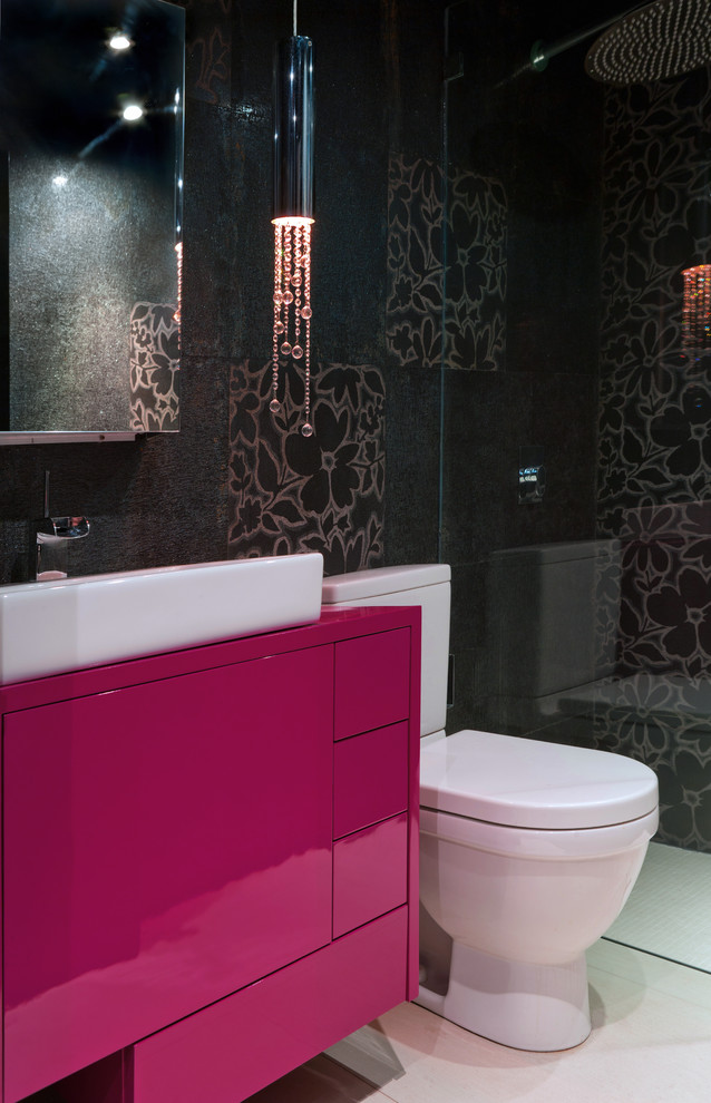 Medium sized eclectic shower room bathroom in Other with flat-panel cabinets, red cabinets, black tiles, ceramic tiles, an alcove shower, a two-piece toilet, a vessel sink, black walls and ceramic flooring.