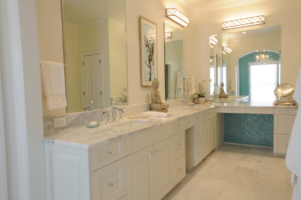 Example of a mid-sized zen master marble floor and white floor bathroom design in Birmingham with raised-panel cabinets, white cabinets, white walls, an undermount sink and marble countertops