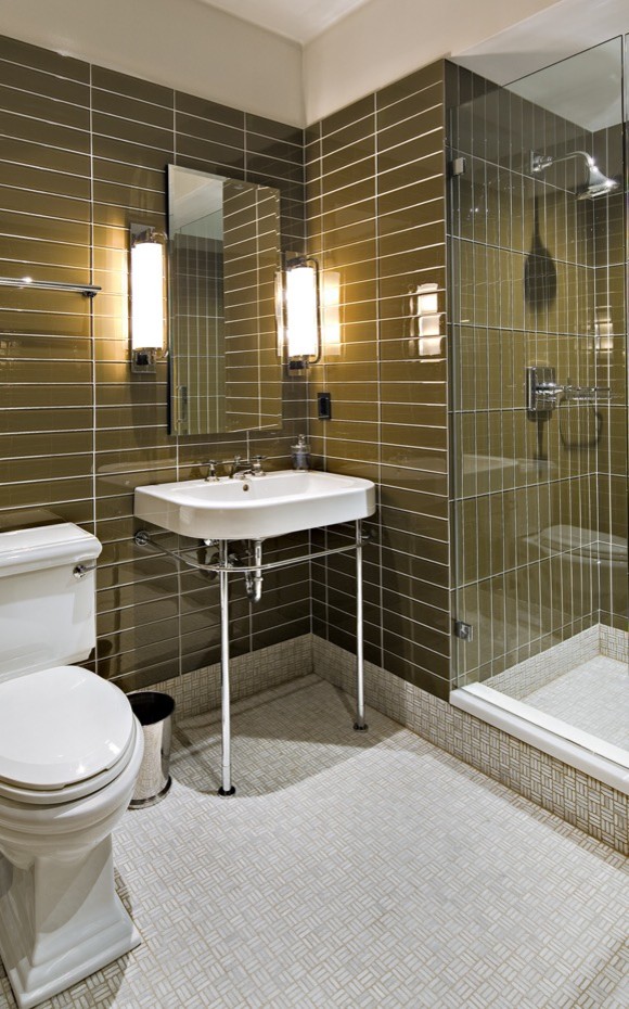 Mid-sized minimalist 3/4 green tile and glass tile mosaic tile floor double shower photo in Houston with a one-piece toilet, brown walls and a wall-mount sink