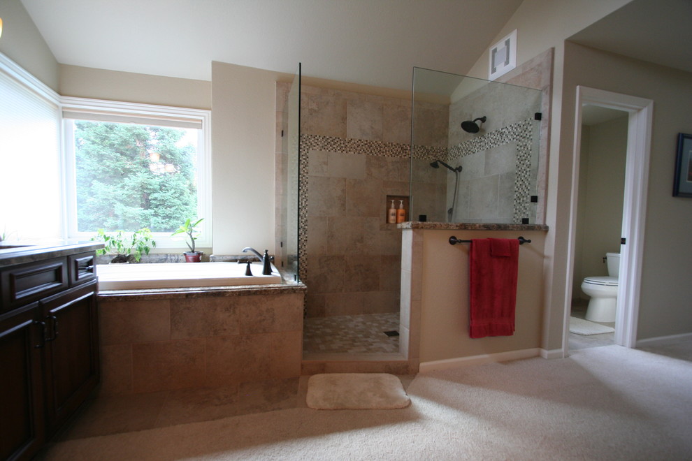 Doorless shower - large traditional master brown tile and stone slab slate floor doorless shower idea in San Francisco with an undermount sink, raised-panel cabinets, dark wood cabinets, granite countertops, an undermount tub, a one-piece toilet and beige walls