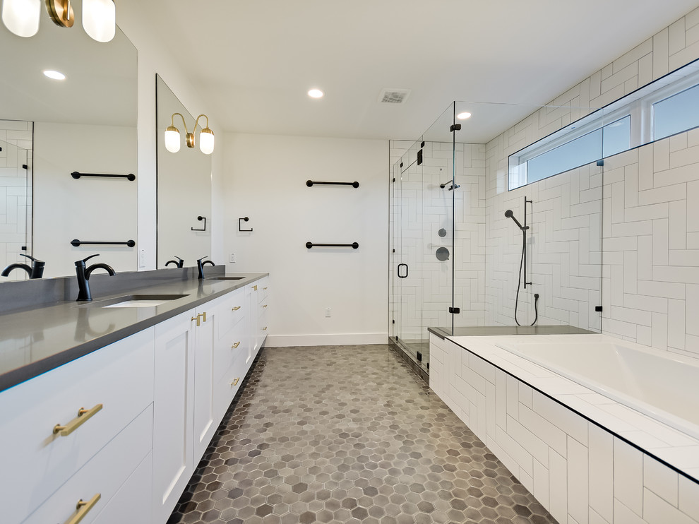 Example of a large country master ceramic tile ceramic tile and gray floor bathroom design in Austin with recessed-panel cabinets, white cabinets, an undermount tub, white walls, an undermount sink and quartz countertops