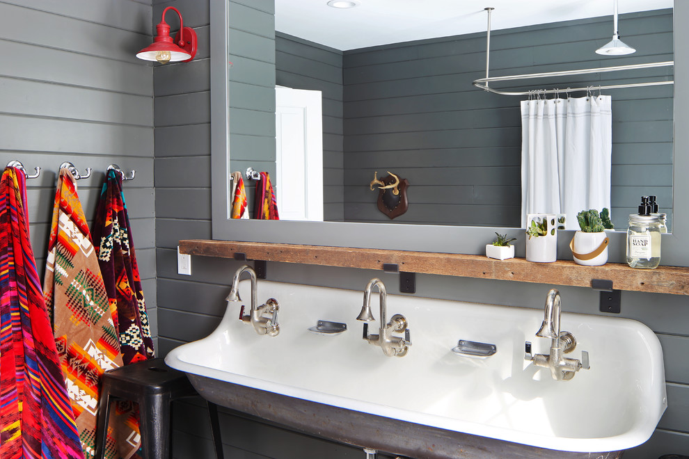Farmhouse family bathroom in Grand Rapids with grey walls, a trough sink and a shower curtain.
