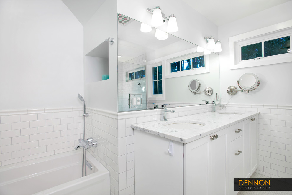 Inspiration for a mid-sized eclectic master white tile and porcelain tile porcelain tile bathroom remodel in Seattle with an undermount sink, shaker cabinets, white cabinets, marble countertops, a two-piece toilet and white walls