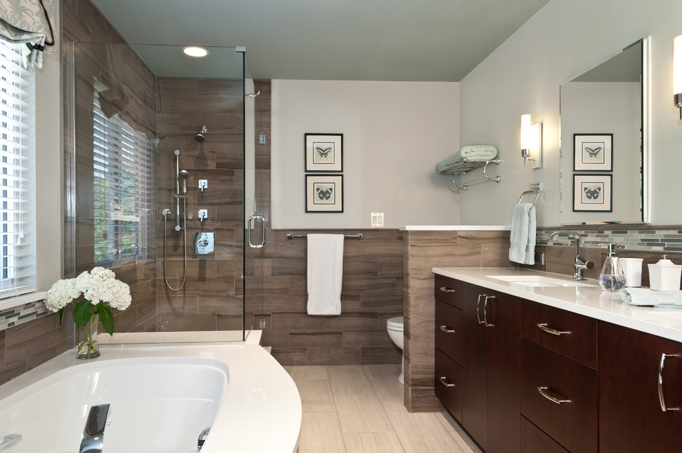 Example of a large transitional master beige tile and porcelain tile porcelain tile walk-in shower design in St Louis with an undermount sink, flat-panel cabinets, beige cabinets, an undermount tub and multicolored walls