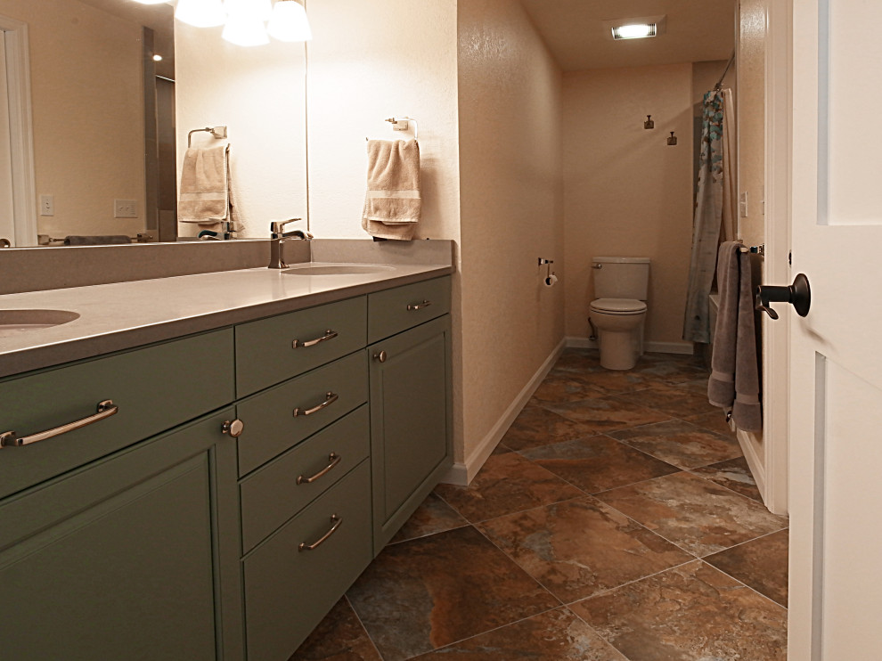 Example of a small transitional master multicolored tile and porcelain tile porcelain tile and multicolored floor bathroom design in Other with raised-panel cabinets, turquoise cabinets, a two-piece toilet, beige walls, an undermount sink, quartz countertops and gray countertops