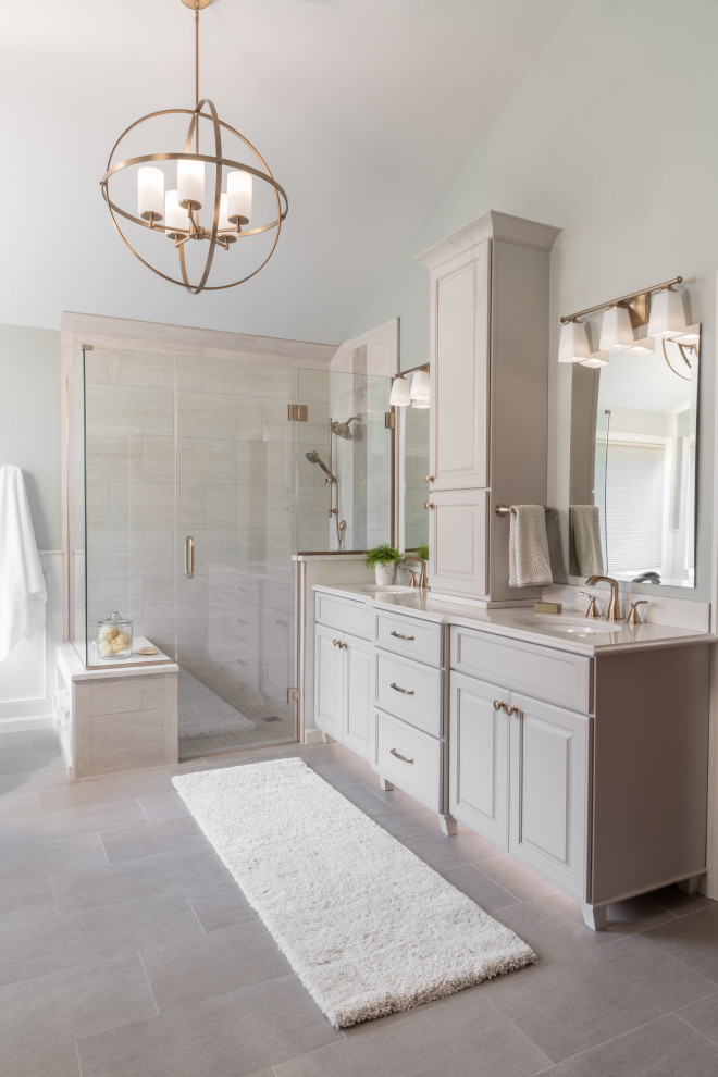 Large transitional master gray tile and ceramic tile ceramic tile and gray floor bathroom photo in St Louis with furniture-like cabinets, gray cabinets, gray walls, an undermount sink, quartz countertops, a hinged shower door and white countertops