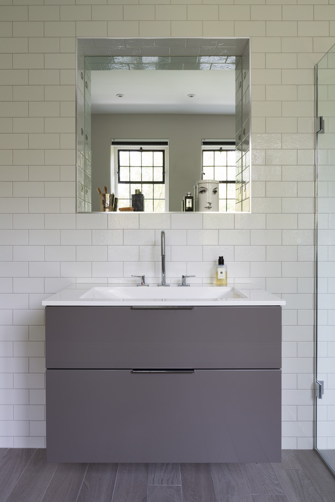 Inspiration for a contemporary bathroom in Other with a wall-mounted sink.