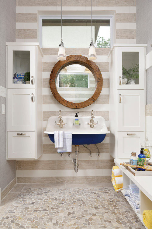 Floating Dreams: Boys Bathroom Ideas with Round Mirror and Blue Sink