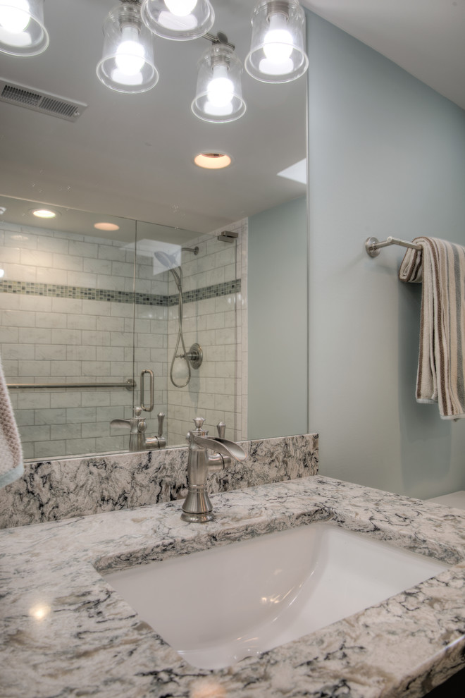 Example of a mid-sized transitional 3/4 gray tile, green tile and mosaic tile marble floor alcove shower design in San Diego with shaker cabinets, dark wood cabinets, a two-piece toilet, blue walls, an undermount sink and granite countertops