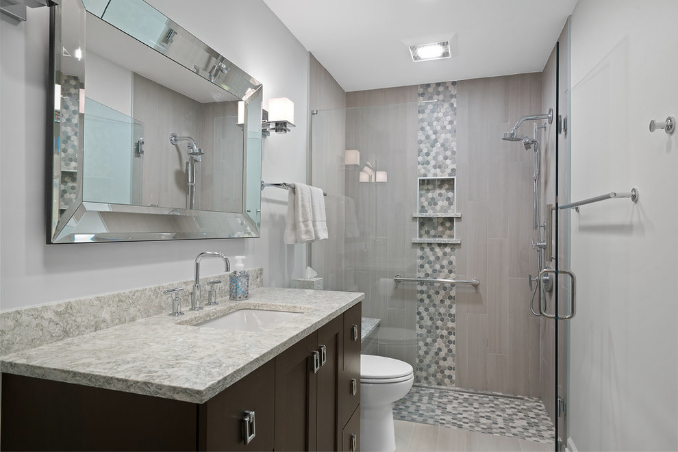 Medium sized classic ensuite bathroom in Columbus with shaker cabinets, grey cabinets, a built-in shower, a one-piece toilet, grey tiles, porcelain tiles, white walls, porcelain flooring, a submerged sink, quartz worktops, grey floors and a hinged door.
