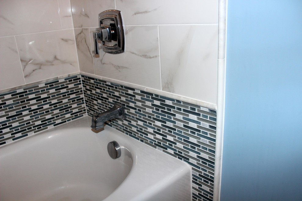 Example of a mid-sized classic master white tile and ceramic tile ceramic tile bathroom design in Baltimore with an undermount sink, recessed-panel cabinets, white cabinets, marble countertops, a one-piece toilet and blue walls